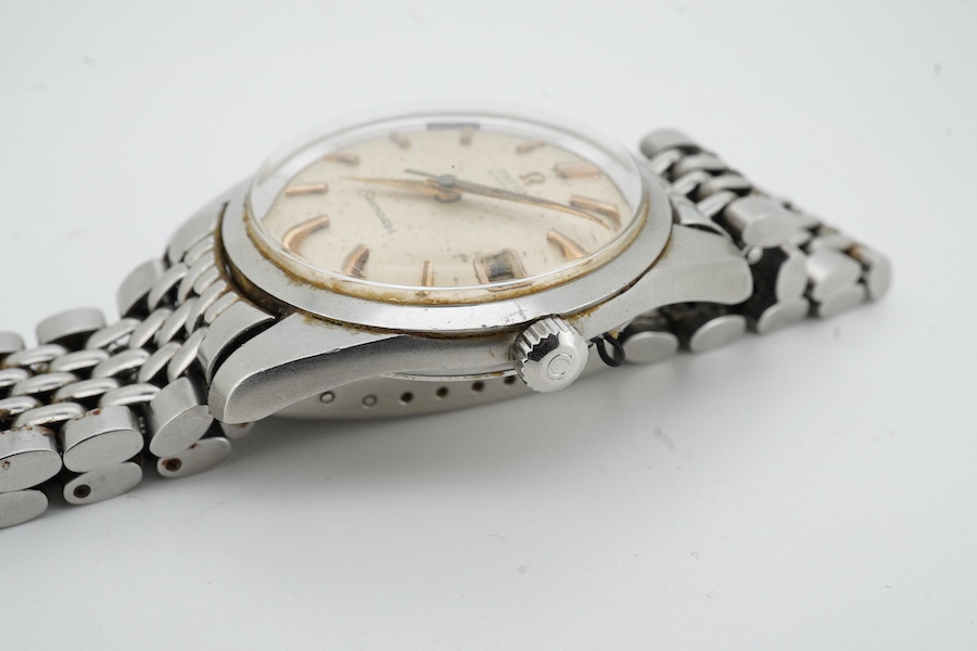 A gentleman's 1964 stainless steel Omega Seamaster Automatic wrist watch, with baton numerals and date aperture, movement 562, case diameter 35mm, on a stainless steel Omega bracelet, with Omega zip up pouch, no papers.